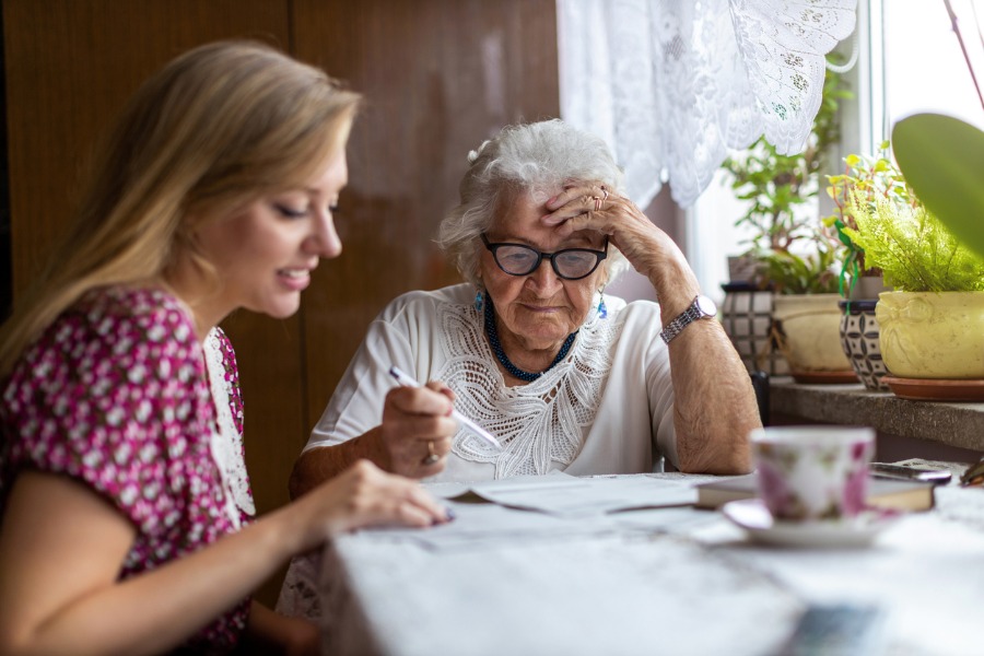 woman-with-senior-organizing-documents